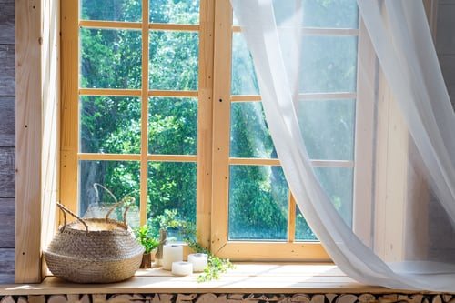Window seat with soft daylight filtering through sheer panels